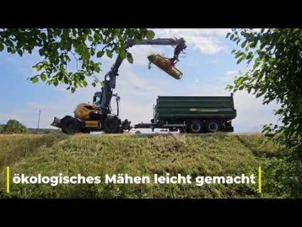 Mobilbagger mit Mähkorb